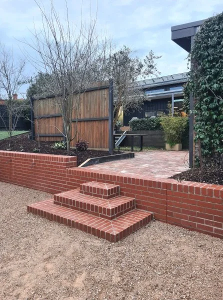 red brick retaining wall with steps