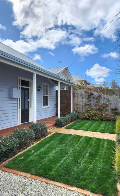 freshly laid grass in front garden of house