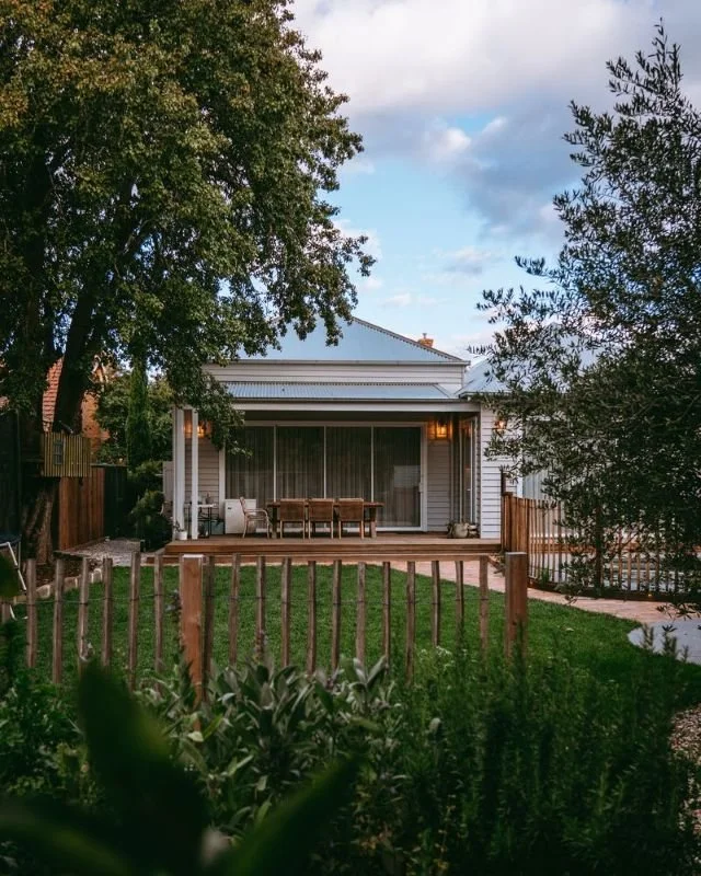 garden with fence grass and house in background.jpg