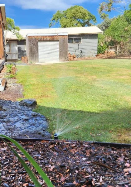 built in watering system watering a lawn