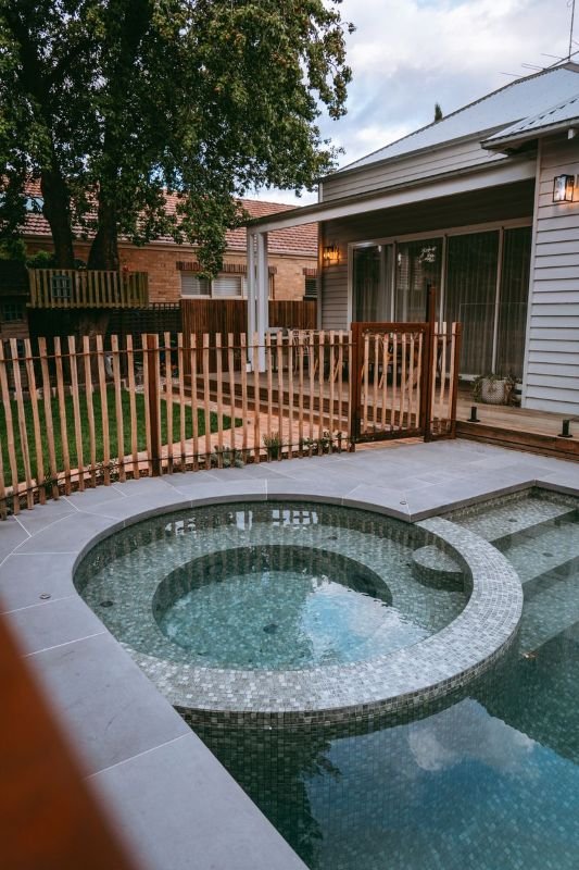 Pool with fence and house in background.jpg