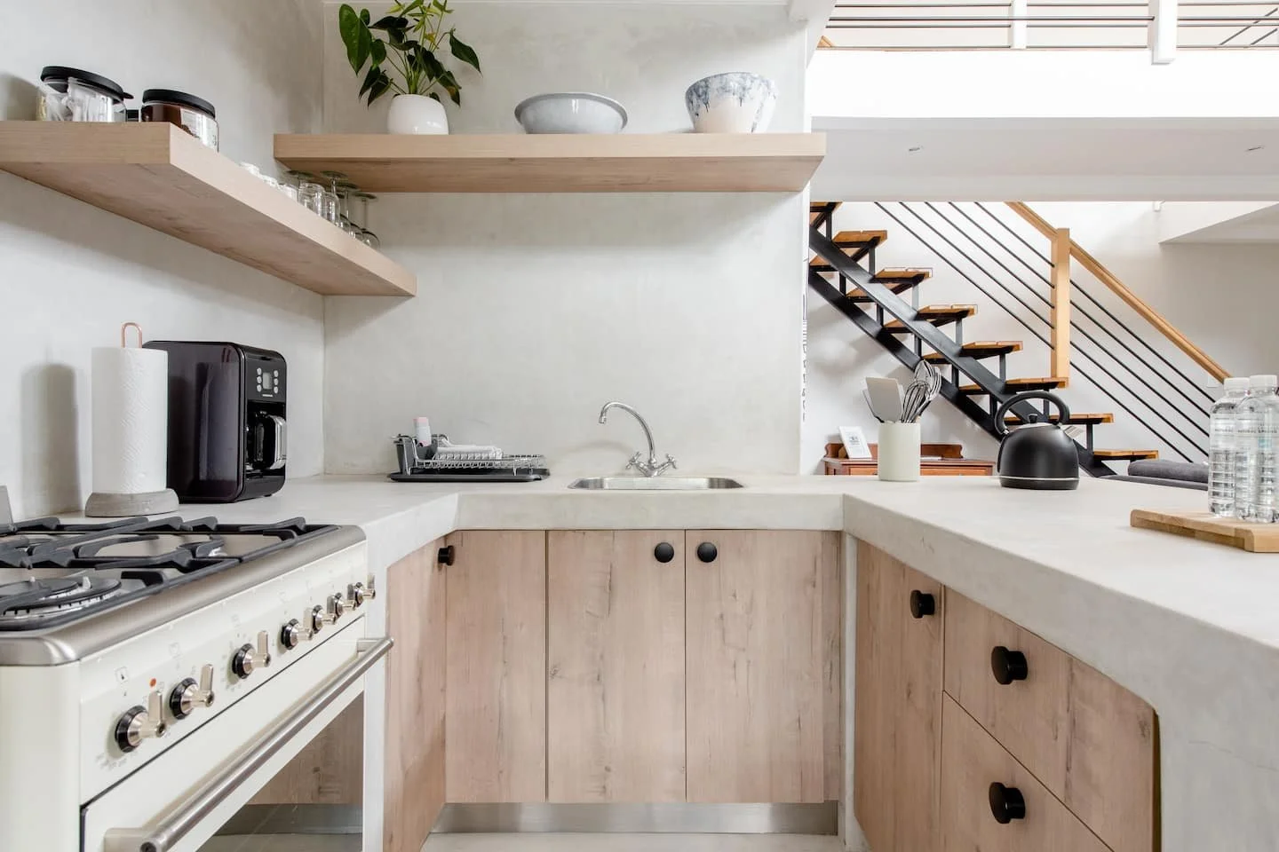 Neutral kitchen interior with wood and cement finishes