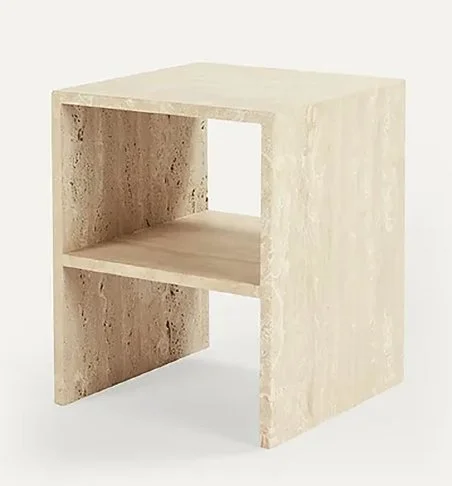 A beige, stone-like cube-shaped nightstand or small table with one open shelf in the middle.