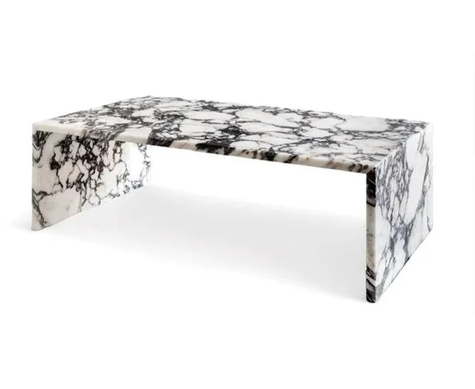 A marble table with a rectangular top and two supporting sides featuring black and white marble pattern.