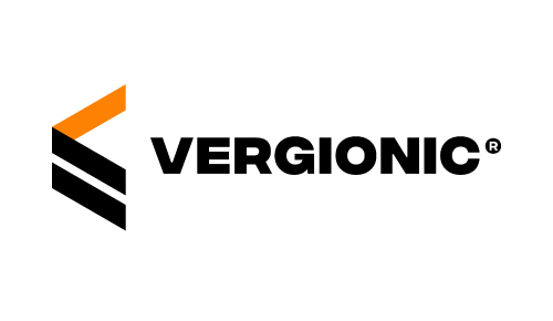 A person in a black suit with an orange tie and an orange pocket square, standing in front of a black background. Vergonic