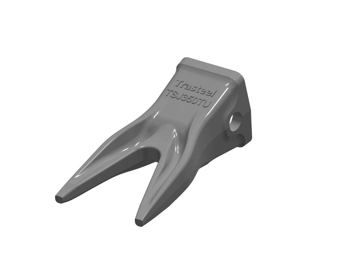 A metal excavator bucket tooth, gray in color, used for digging in construction equipment.