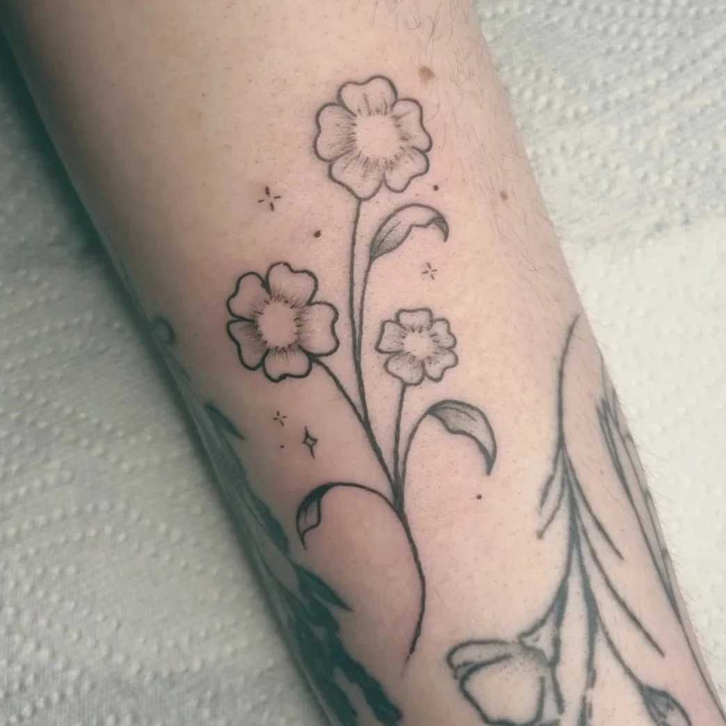 Illustrative botanical flower tattoo 