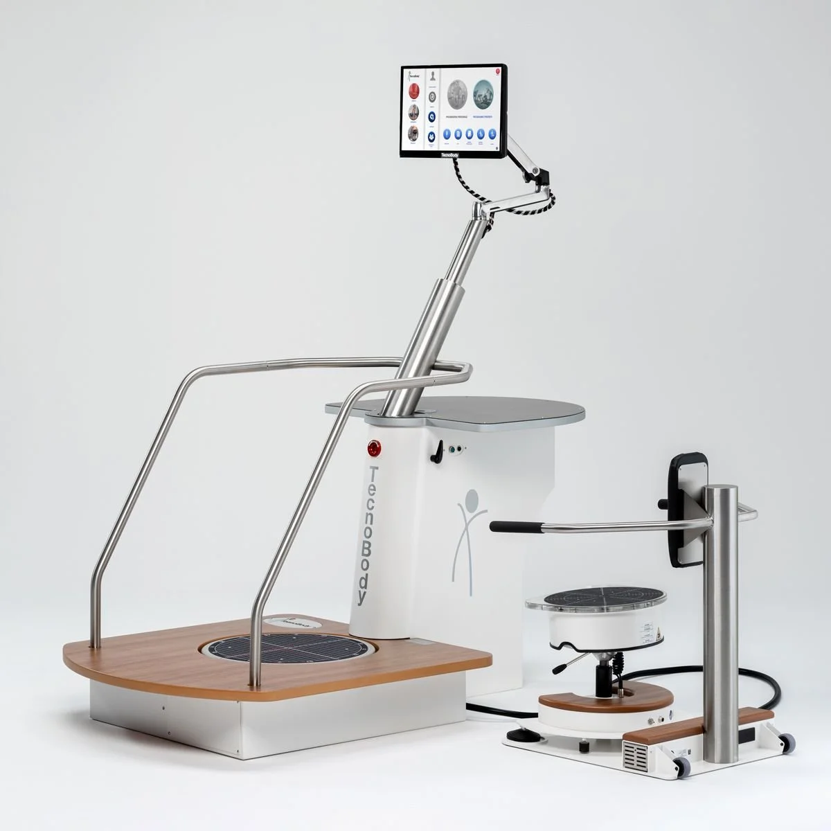 Medical device for whole-body vibration therapy with a wooden platform, metal handrails, a screen on an adjustable arm, and a motorized vibrating platform on a wheeled base.
