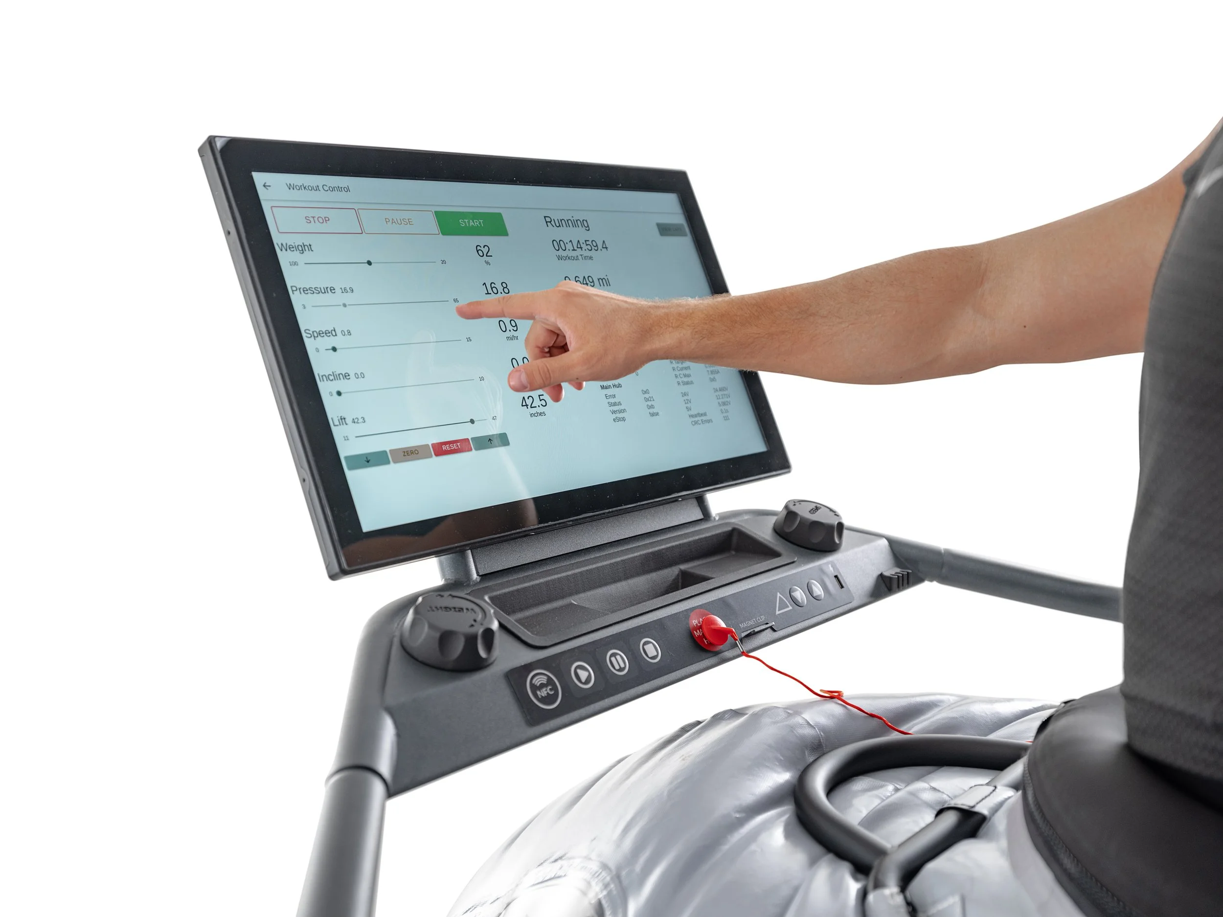 A person using an exercise machine touchscreen control panel with options for workout control, including start, pause, and stop buttons, as the person's arm touches the screen.