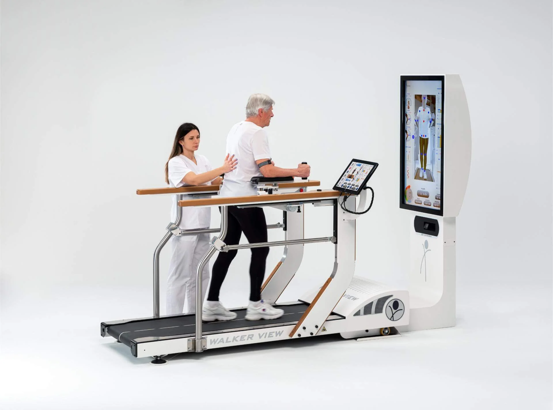 A person undergoing a medical examination on a walker view treadmill with a healthcare professional assisting.