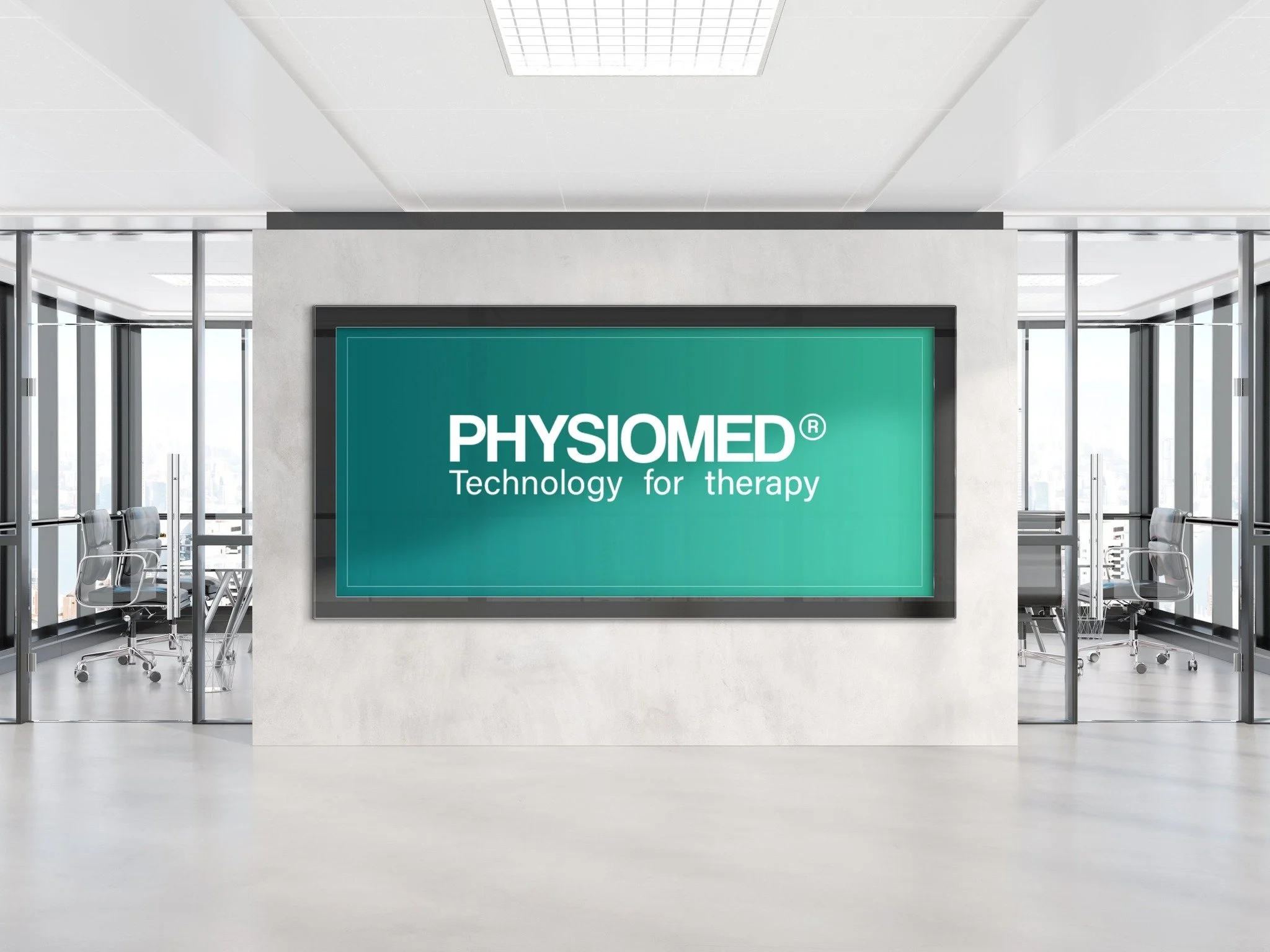 Modern conference room with glass walls, metal chairs, and a large digital screen displaying 'PHYSIOMED' and 'Technology for therapy' on a teal background.