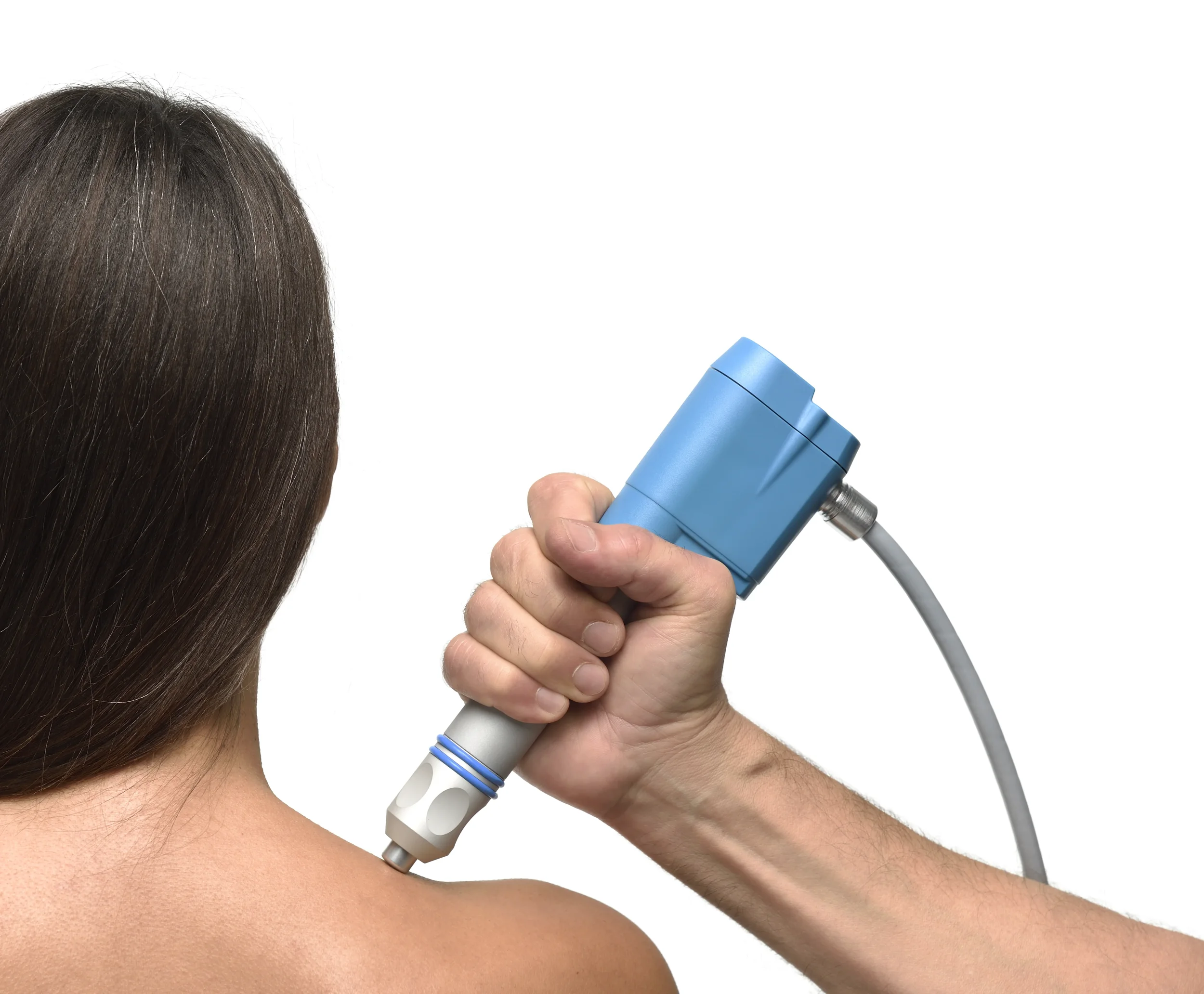 Person receiving a laser therapy treatment on their shoulder, with a healthcare professional holding a blue laser device.