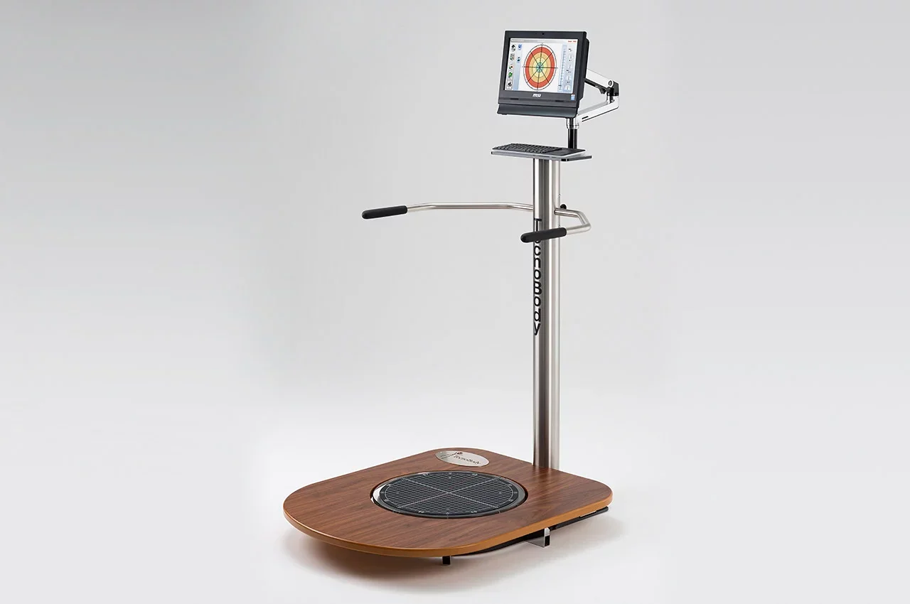 Vibration exercise machine with a digital screen displaying a target graphic, a small platform, adjustable handle, and a wooden base.