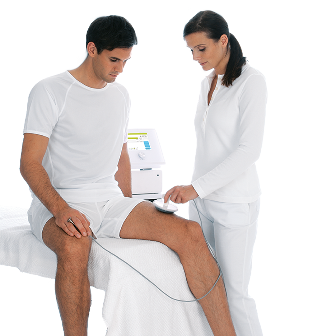 Medical professional performs an ultrasound on a male patient's thigh.