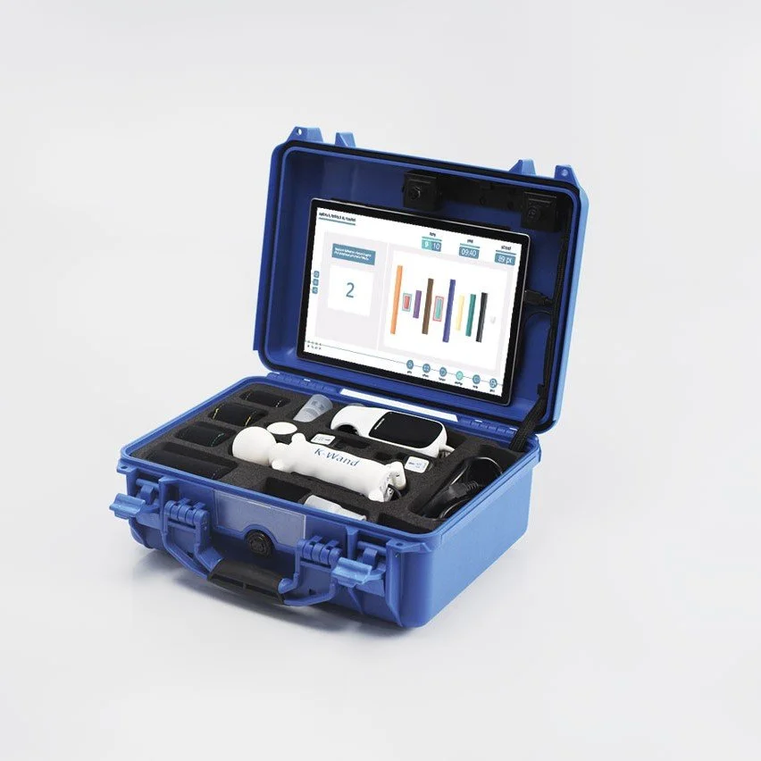 Open blue protective case containing medical devices, a tablet displaying data, and various medical tools, including ultrasound probe and sensors.
