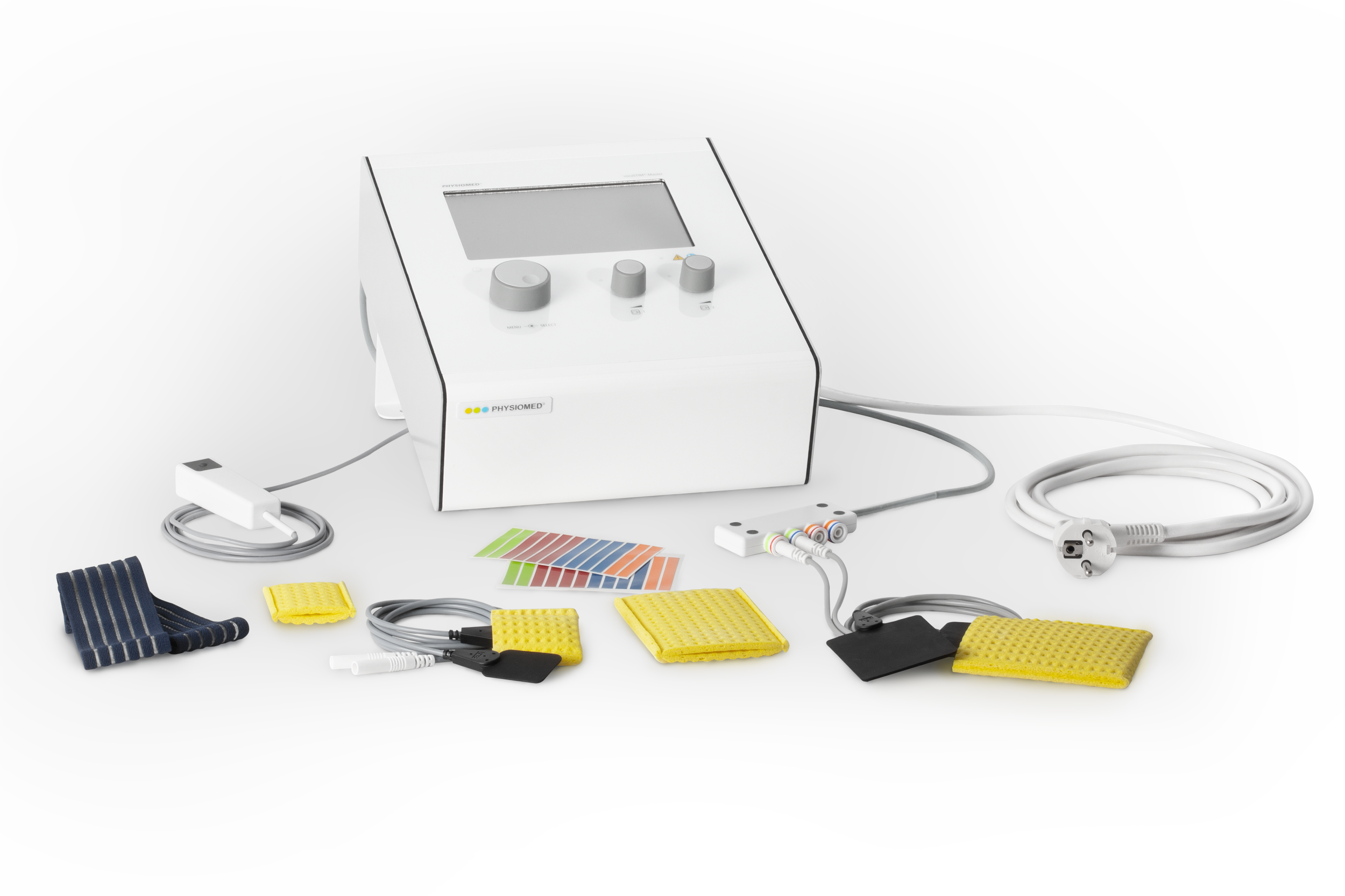 Medical diagnostic device with various accessories, cables, color strips, and textured pads placed on a gray surface.
