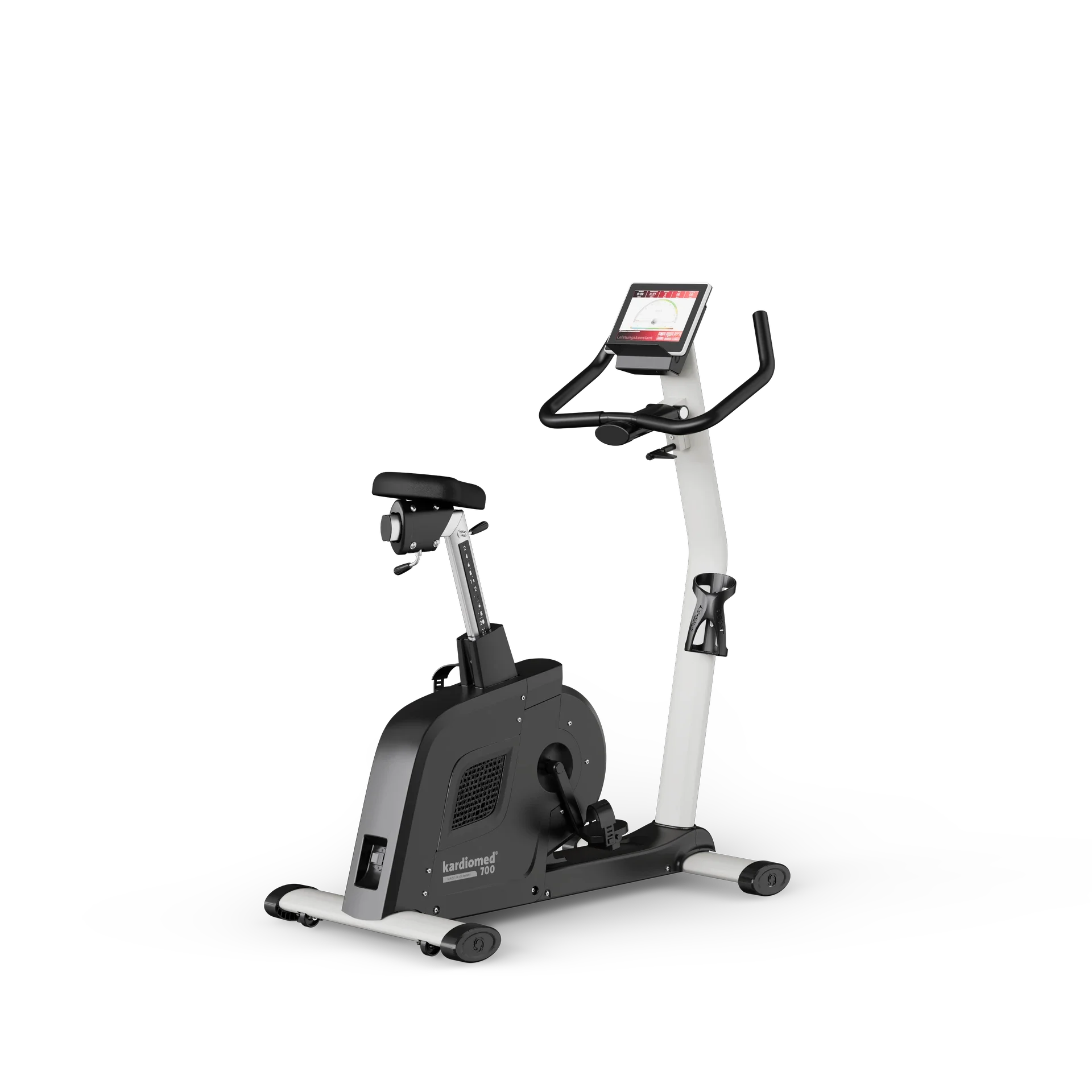 A modern stationary exercise bike with a digital display screen, black handles, and a black and white frame, branded as 'kardiomed 700.'