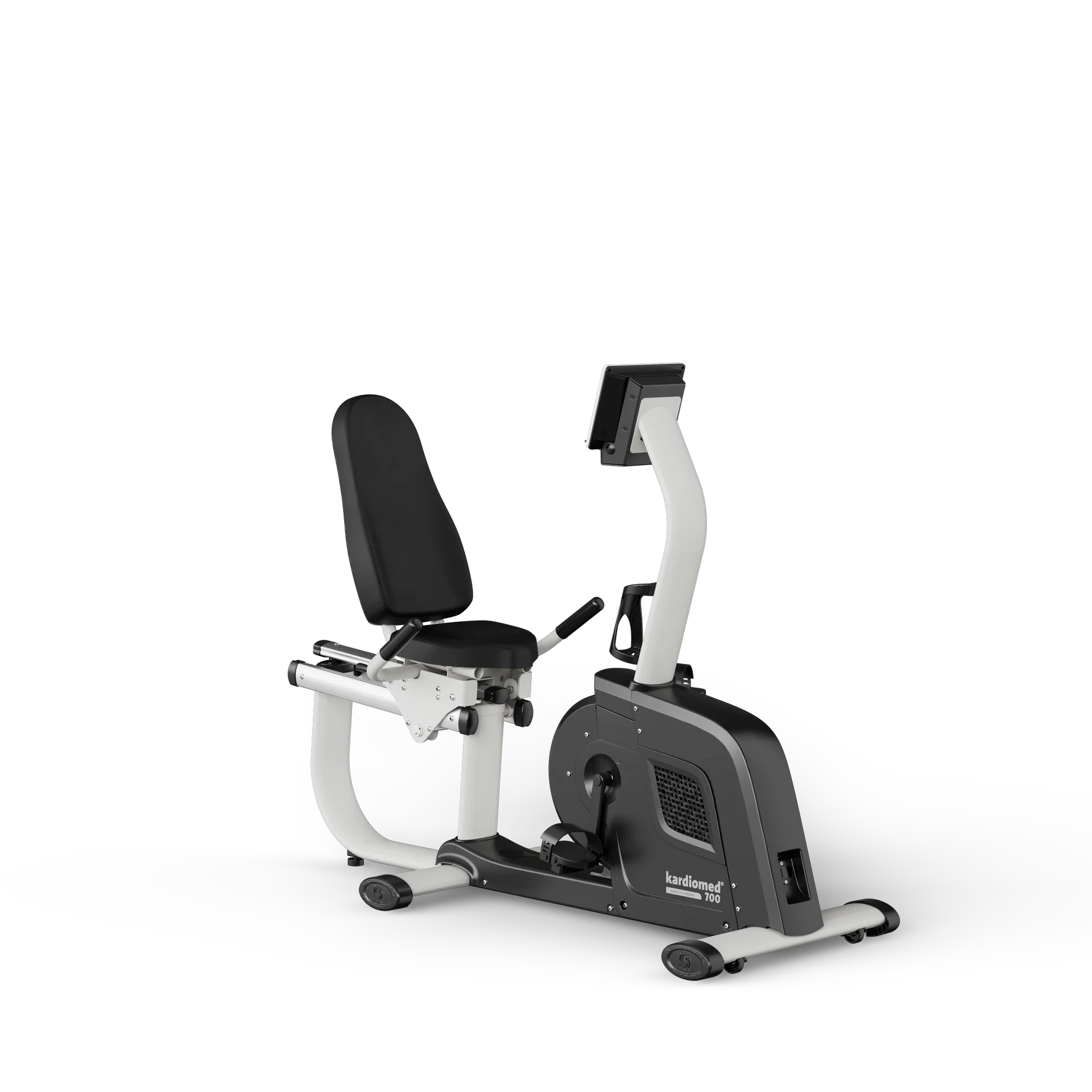 A black and white exercise bike branded 'kardiomed' with a digital display screen, adjustable seat, and pedals.