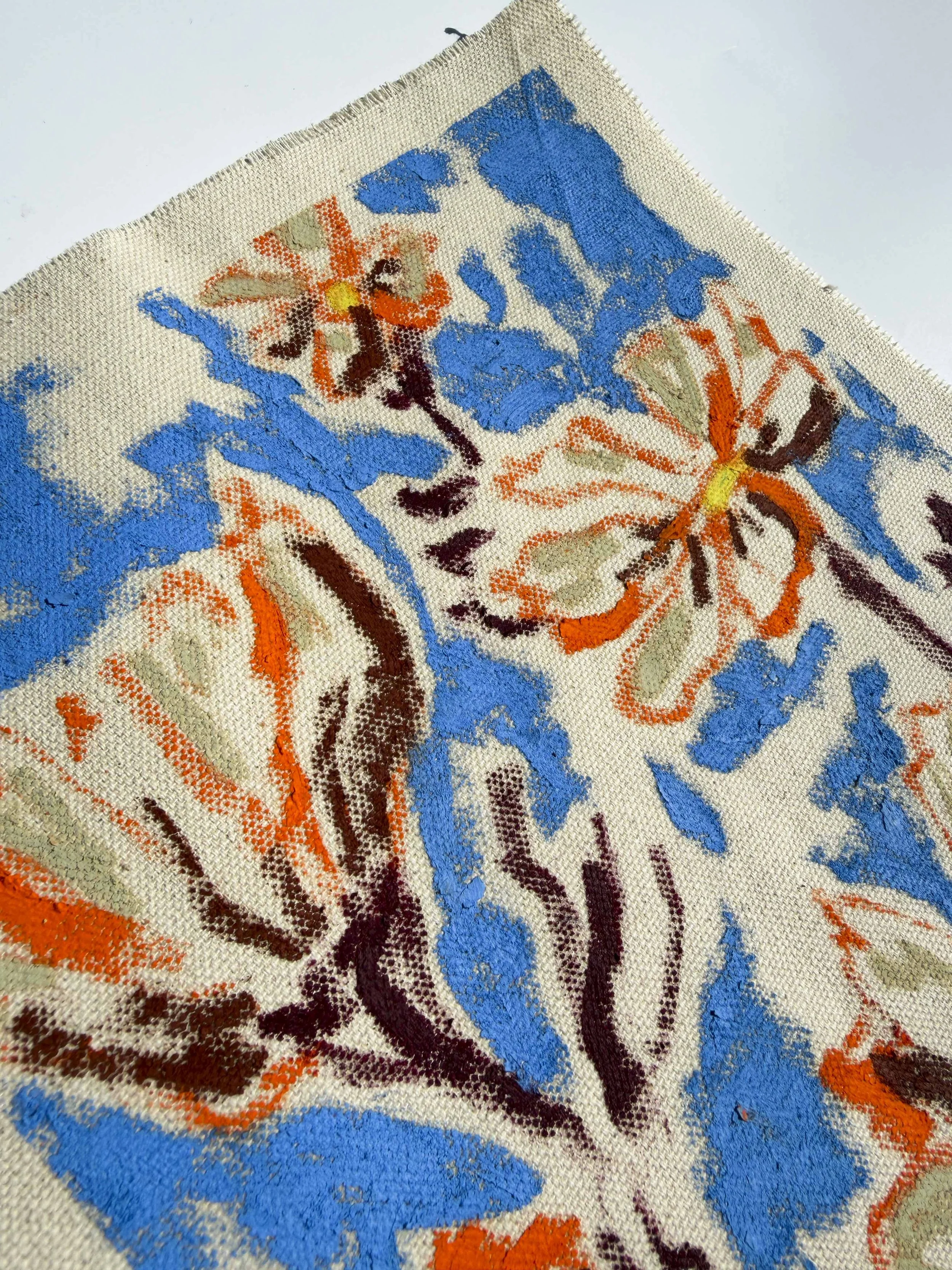 Abstract floral painting in cornflower blue and orange tones on raw unframed canvas, part of the In Bloom collection