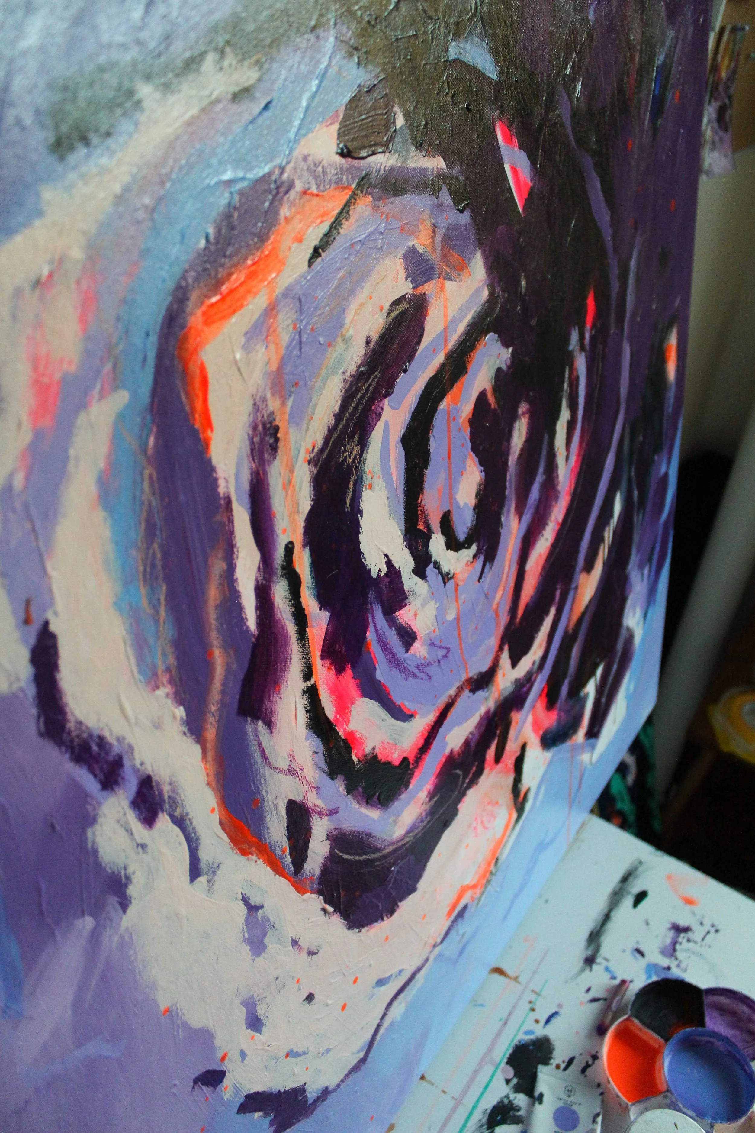 Abstract painting resembling a swirling rose in deep purple, blush pink and cornflower blue, gloss varnish finish