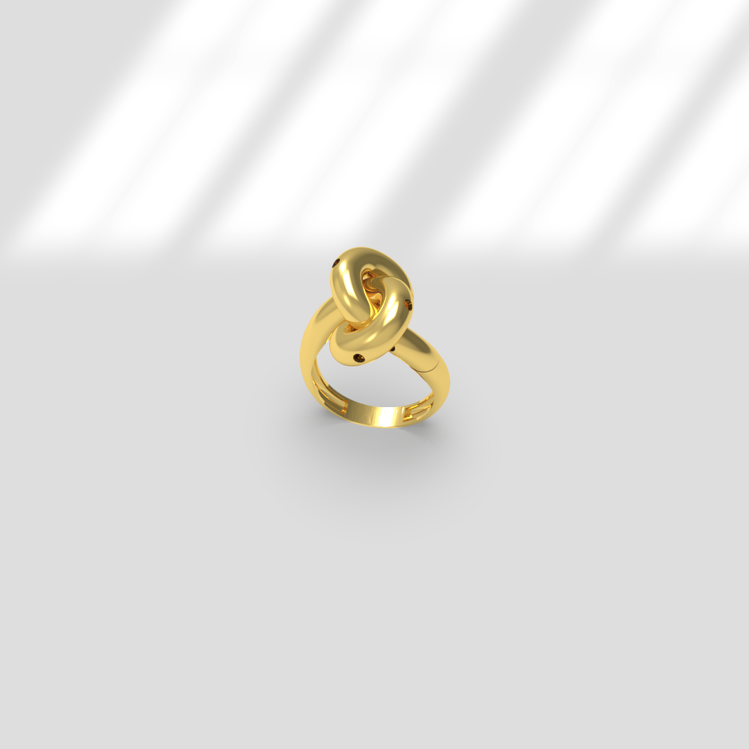 Une bague en or avec un design torsadé, posée sur une surface blanche.