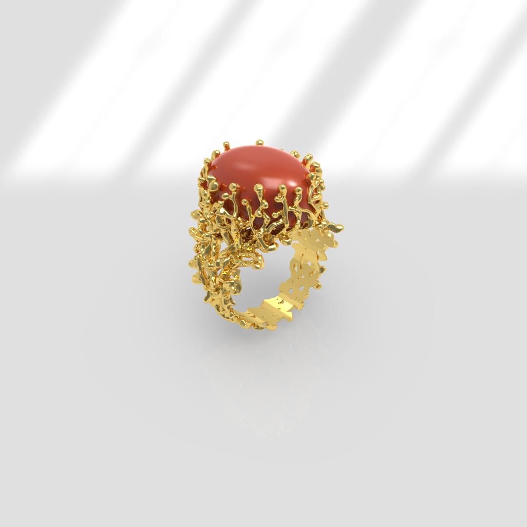 Bague en or avec une pierre orange ronde au centre et un design ornemental complexe.