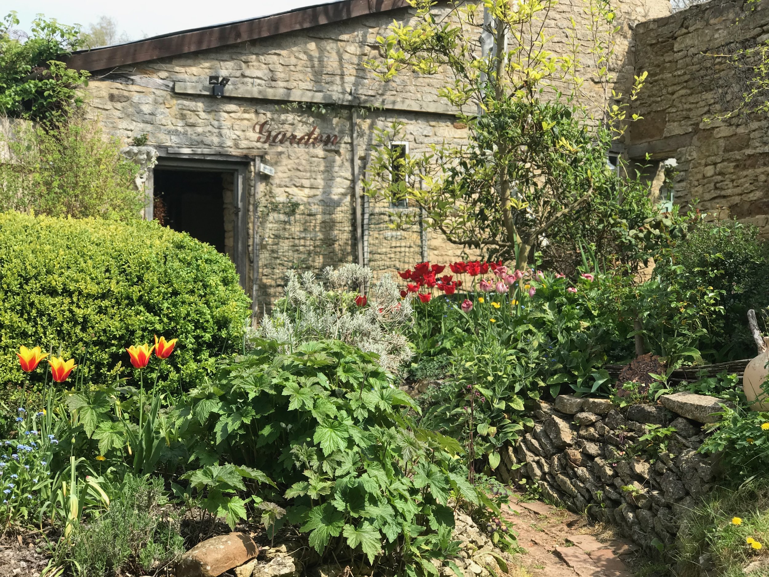 A winding garden path with teasing views to a garden beyond...