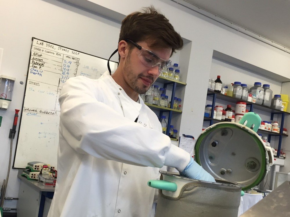 Man in white lab coat in laboratory