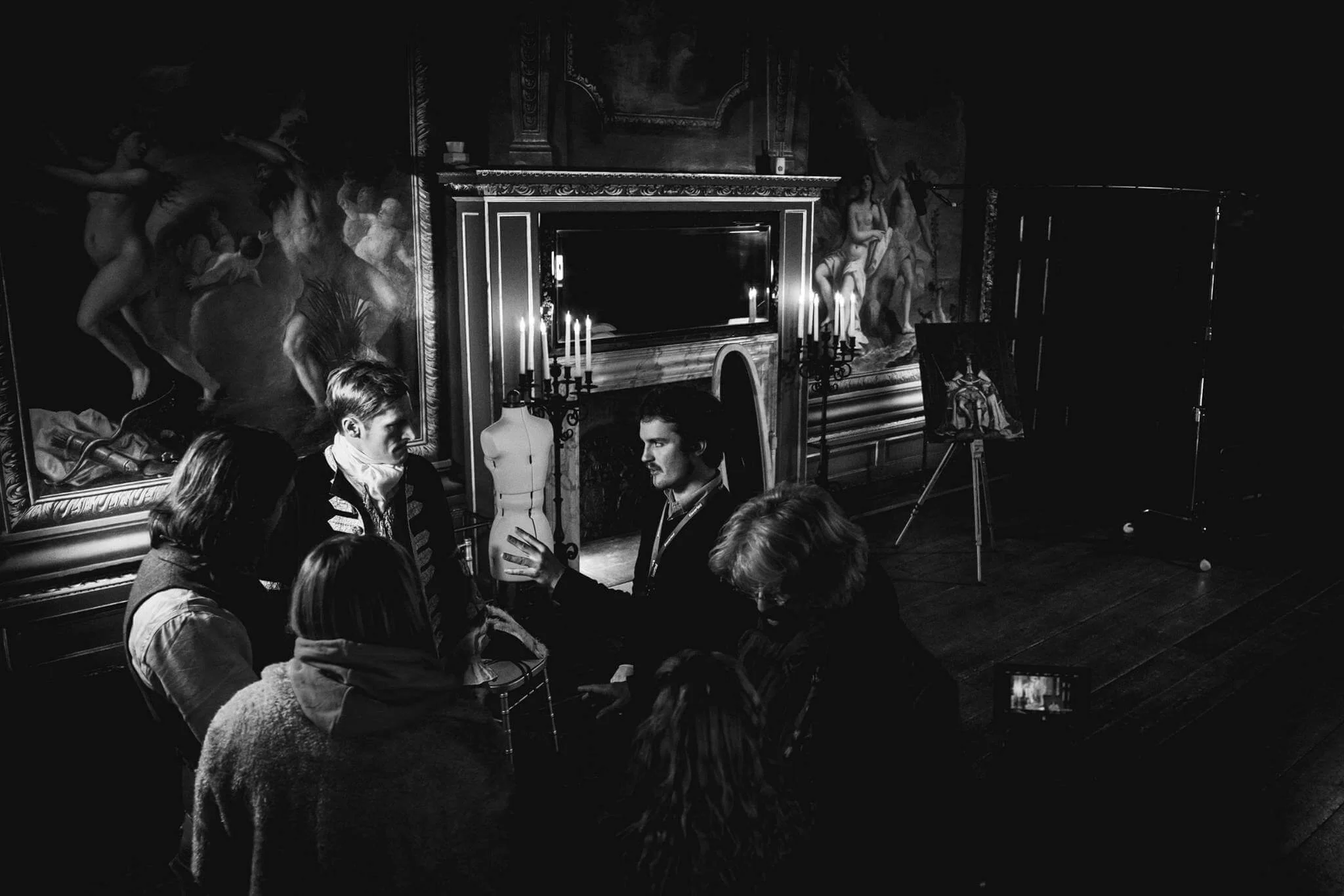 Robbie McKane directing actors on set at Hampton Court Palace