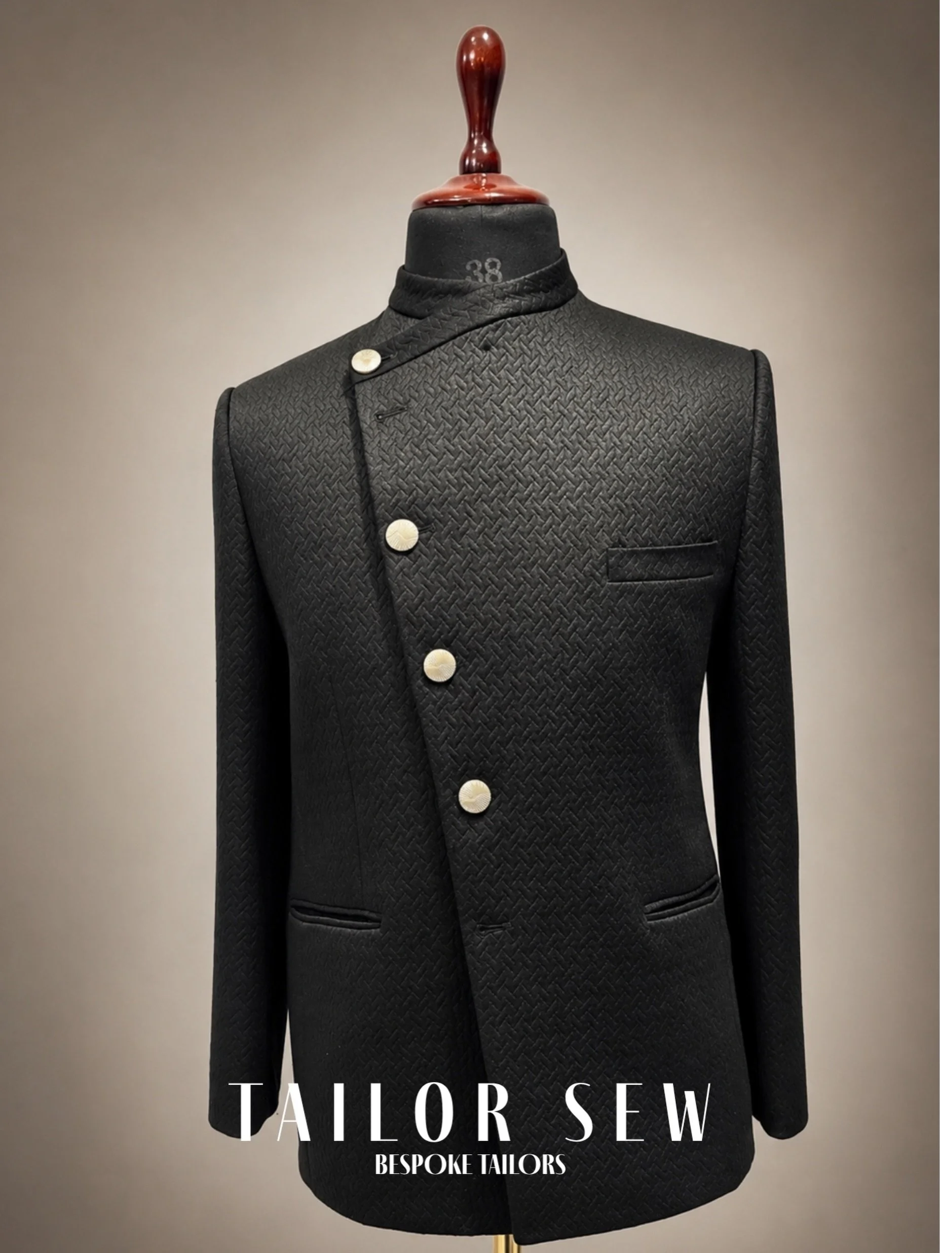 Tradition, untraditional. 🖤✨

Break away from the ordinary with our Bespoke Asymmetric Bandhgala Jacket. Handcrafted at our KNK Road atelier, this creation features a sophisticated basketweave texture and a striking diagonal button configuration tha