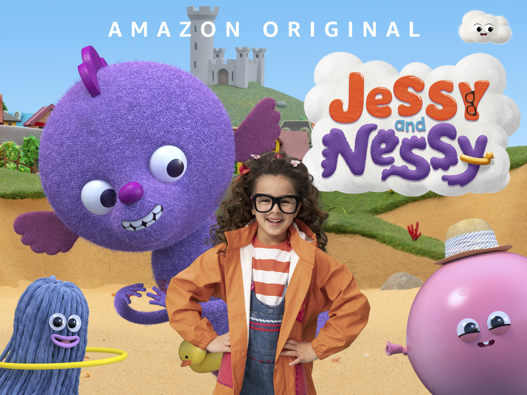 A young girl with glasses, a striped shirt, and an orange jacket standing in front of a colorful cartoon landscape with animated characters including a purple fluffy creature, a pink ball with a straw hat, a blue yarn character with a hula hoop, and a green duck, with a castle in the background and clouds overhead. The title 'Jess and Nessi' is displayed above.