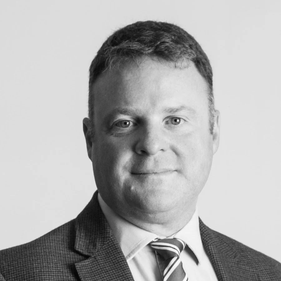 Gary Peace Crisis Management Specialist - headshot of a man wearing a suit and striped tie.