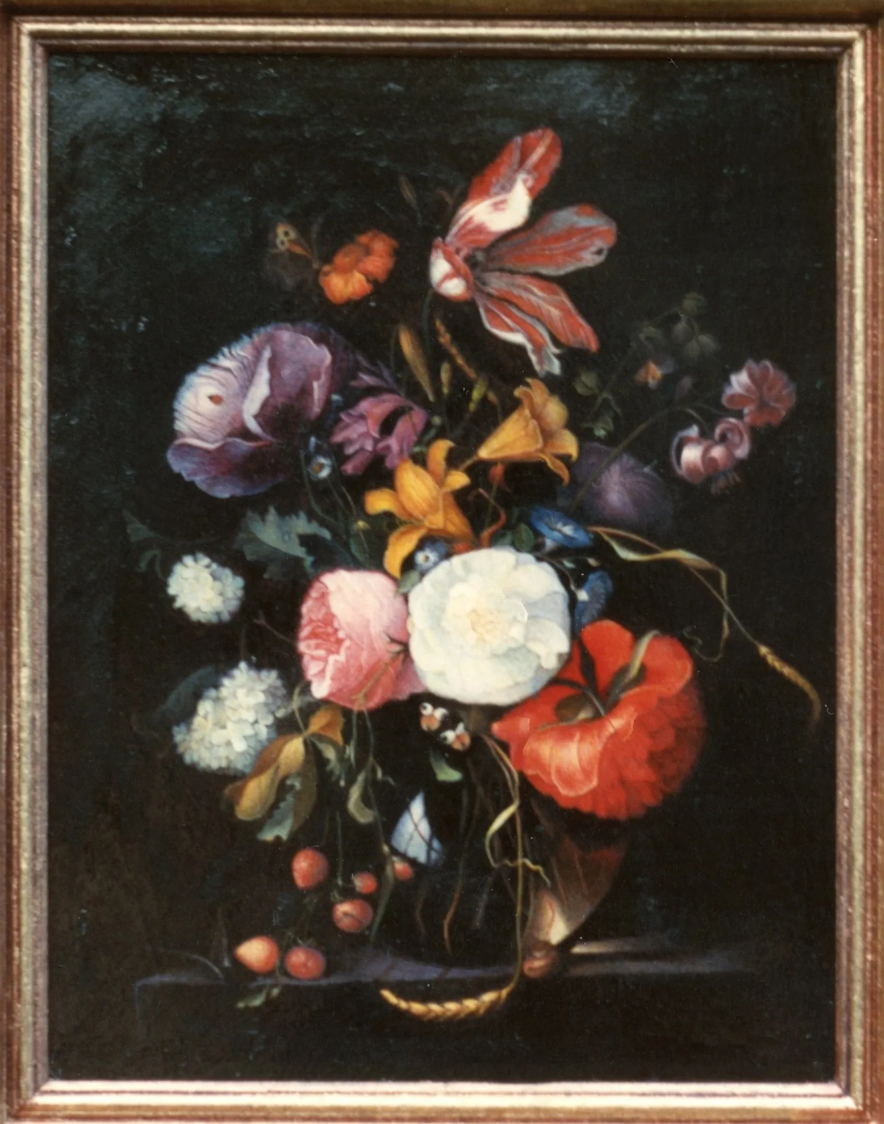A still life painting of colorful flowers, birds, and berries against a dark background, framed in a gold frame.
