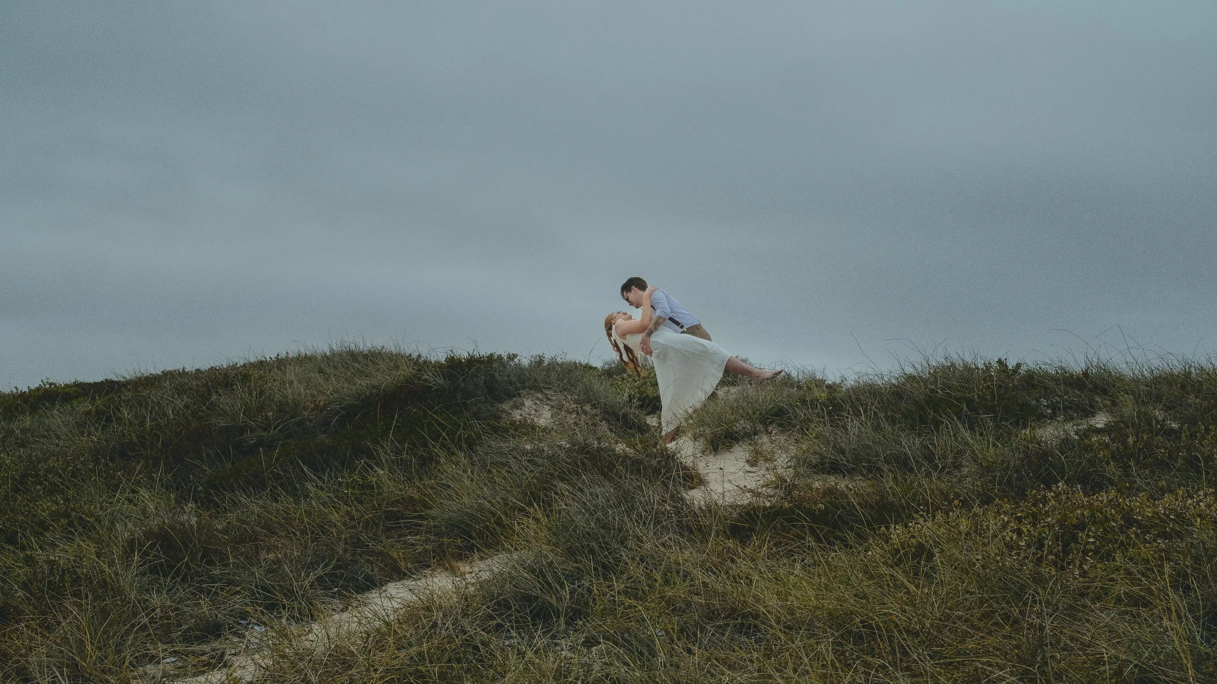 Couple during elopement on sand dunes in Cape Town.
