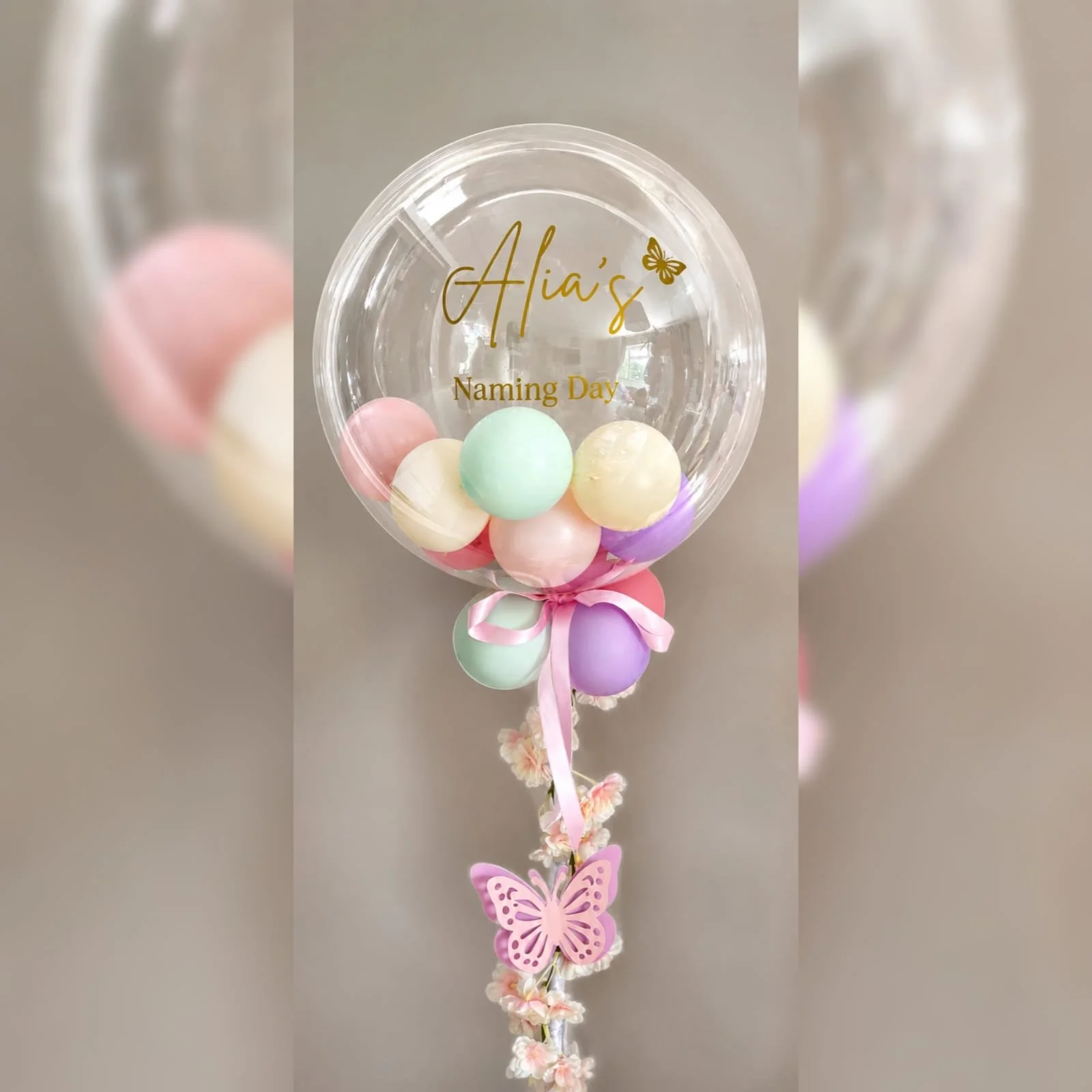Luxury personalised bubble balloon columns featuring premium balloon styling, perfect for Naming Days, Christenings, Baby Showers and special celebrations in Stevenage and Hertfordshire.
