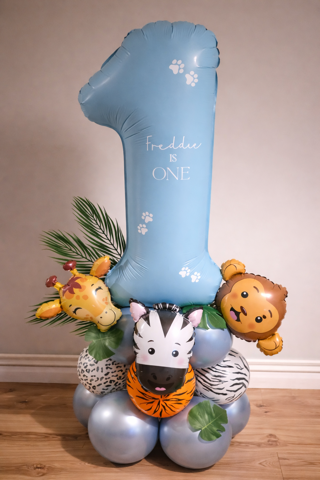 First birthday balloon display with safari animals and number balloon for a birthday celebration in Hertfordshire by B'Loonies.