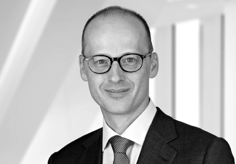 Black-and-white professional headshot of Andy Olding, founding partner of Thorium Capital.