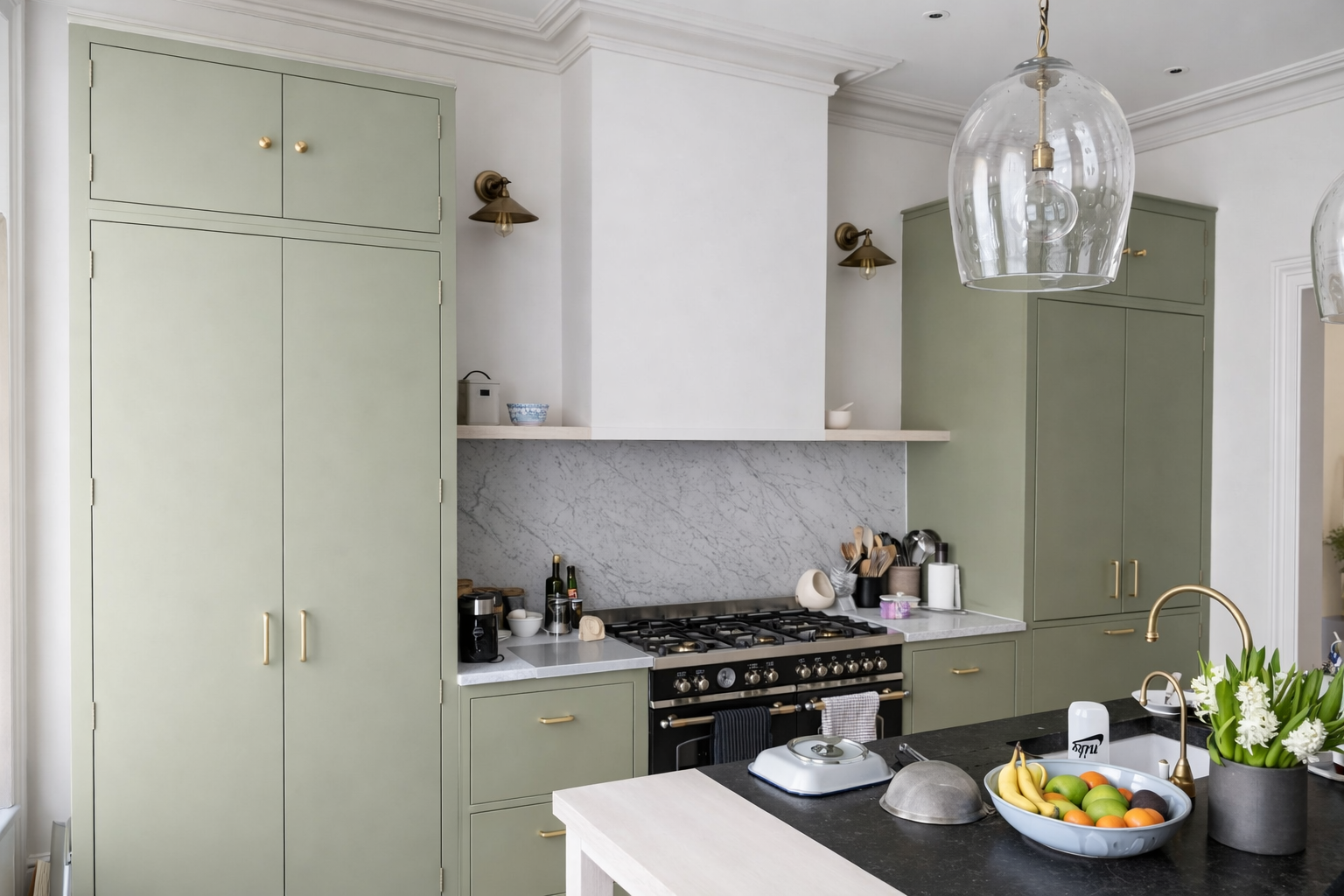 Kitchen with sage green cabinetry, Belgian Fossil marble island and cararra marble splashback