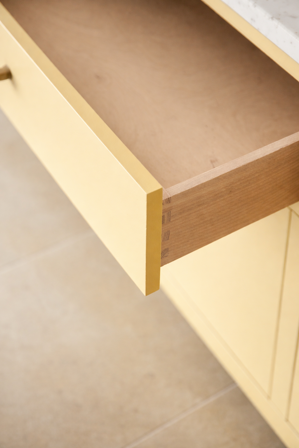 Solid dovetailed Ash drawer detail in painted kitchen joinery
