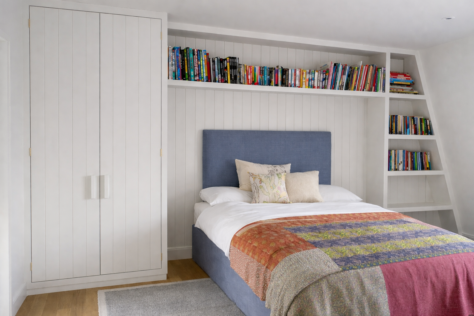 Bedroom joinery with wardrobe and open shelving above bed