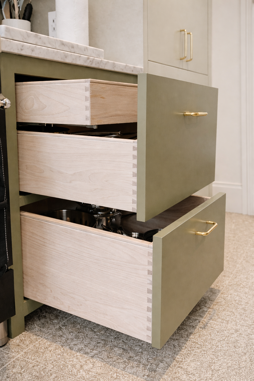 dovetailed ash drawer detail in painted kitchen cabinetry