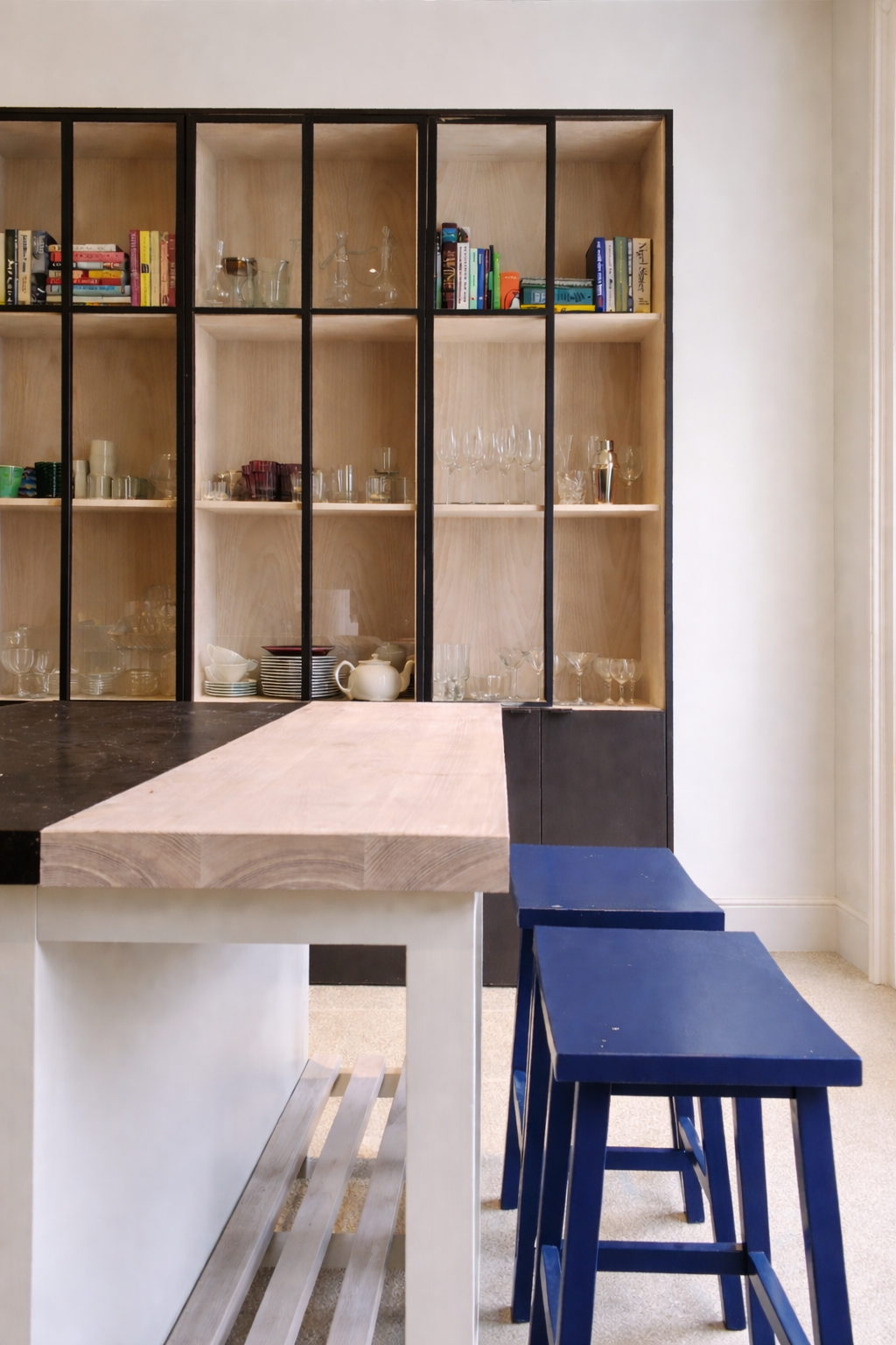 black metal glazed dresser behind island