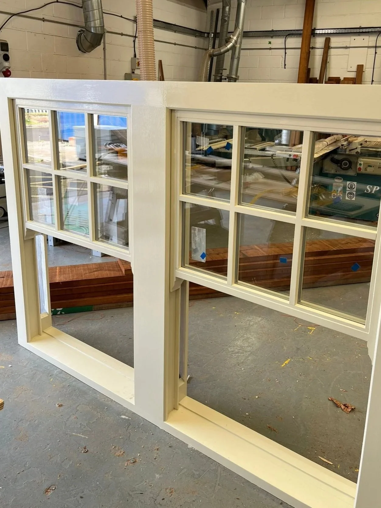 Traditional timber sash window under construction in bespoke joinery workshop Sunderland Tyne and Wear”