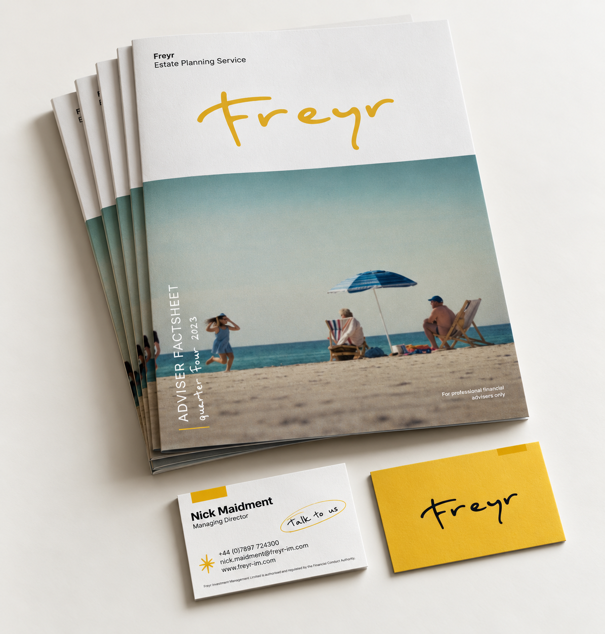 FreyR estate planning service brochure, business card, and yellow branded card arranged on a white surface