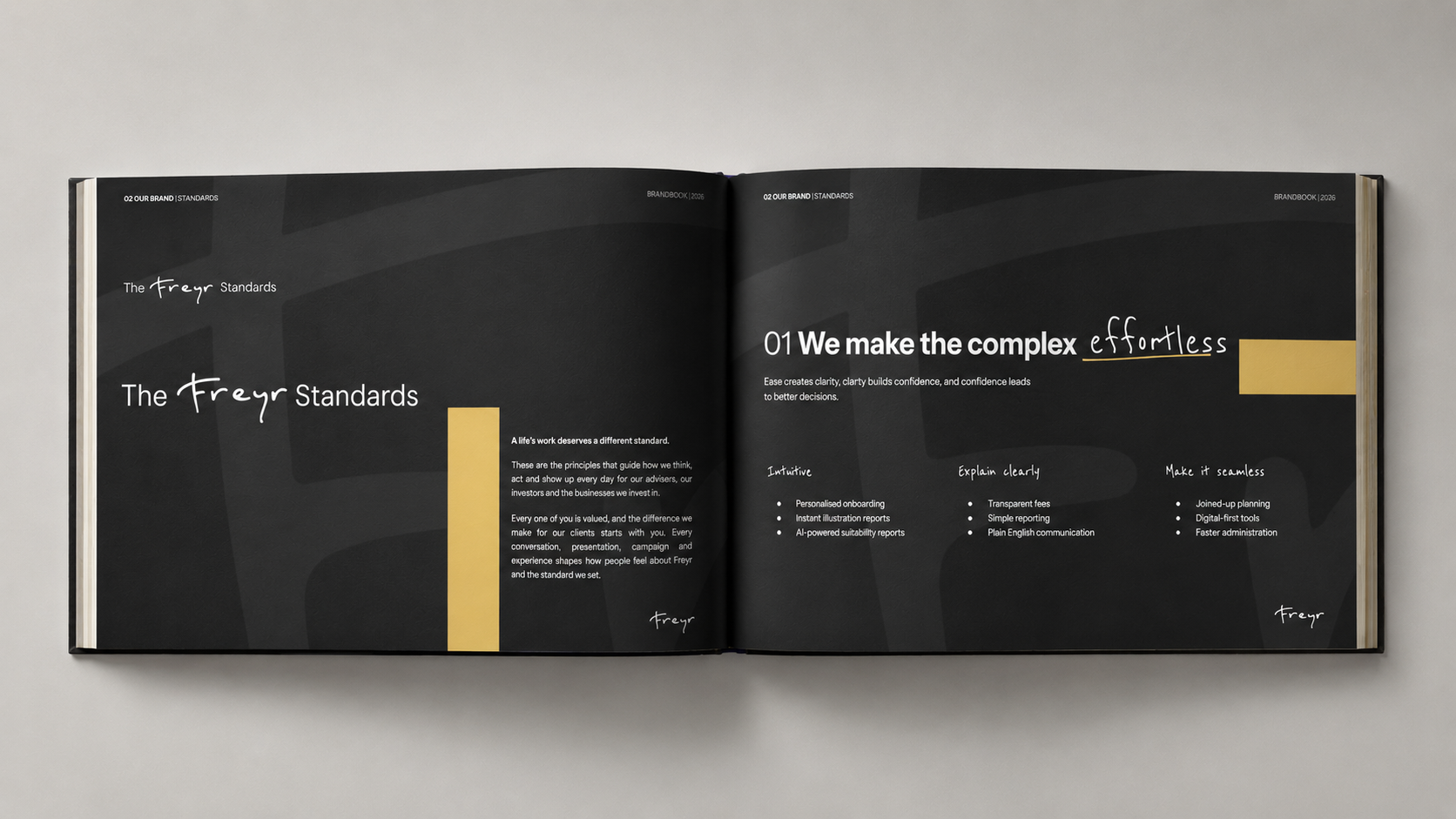 Open black Freyr brand standards book displaying the principle “We make the complex effortless” with handwritten accents and yellow design elements