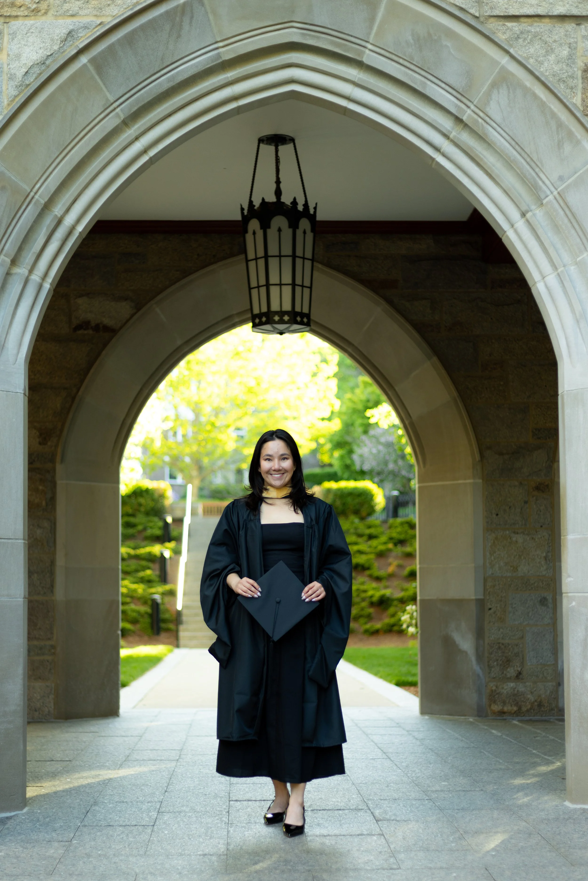 High Quality image of graduate posing in front of an archway