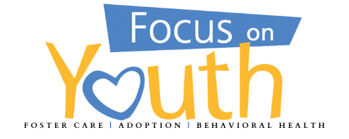 Logo with the phrase "Focus on Youth" in colorful letters, with a heart symbol in place of the letter "o" in "on."