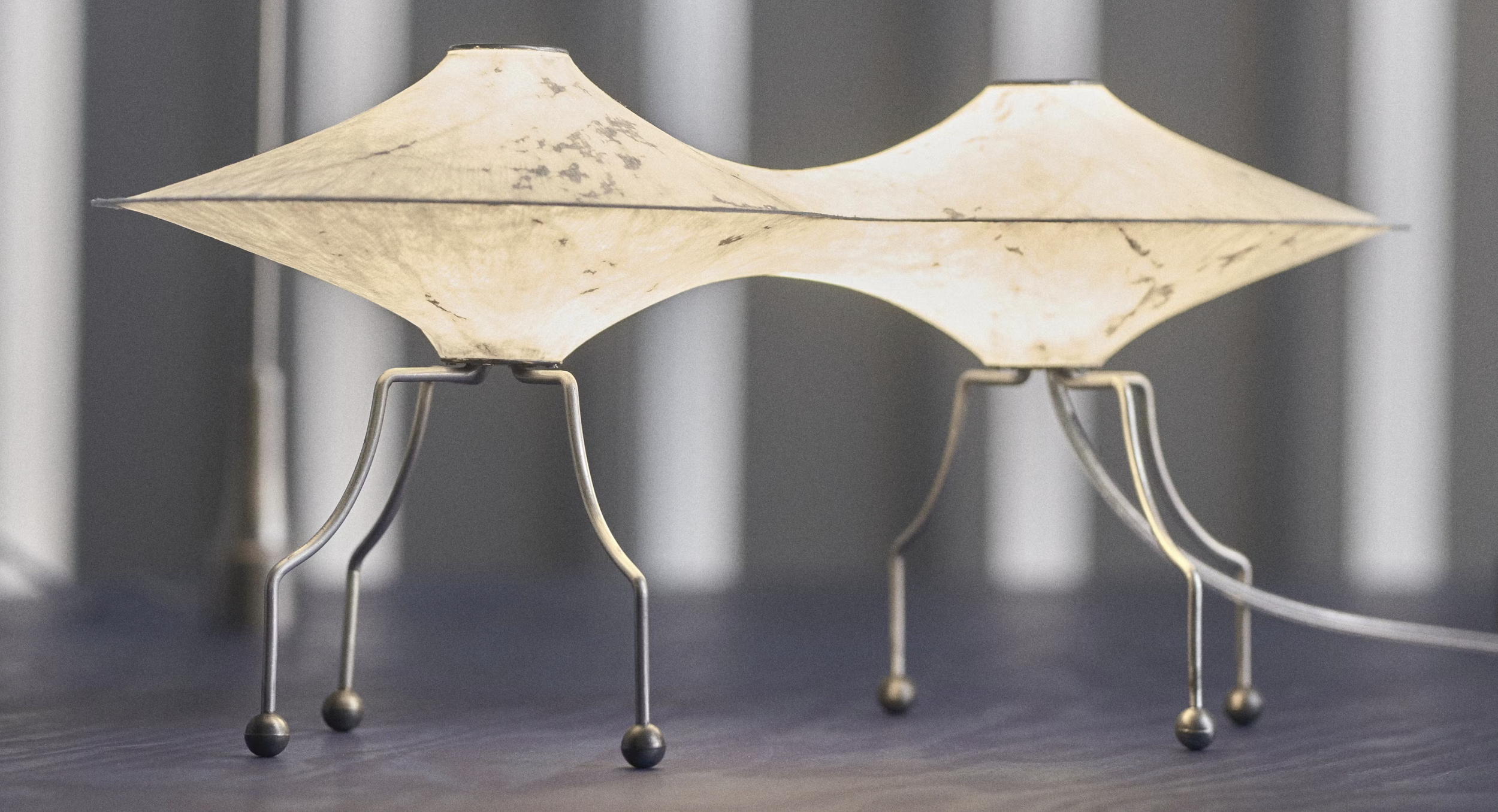Modern artistic lamp with metal legs and textured shades