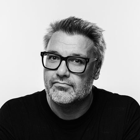 Black and white portrait of a man with glasses and facial hair