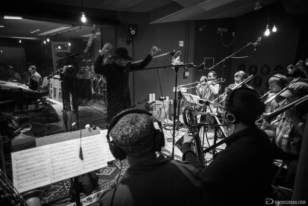Music arranger and producer Rob Lewis conducting musicians in Red Bull Studios, NYC, for Christina Aguilera's Opening performance for the All Star Game at Madison Square Garden.